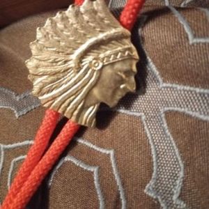 Indian head bolo with red chord and Silver Tips